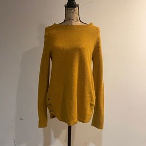 Gold sweater with buttons on lower side
